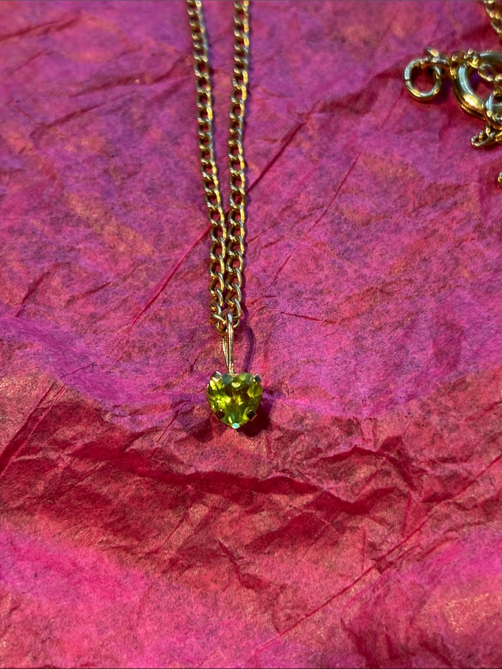 10K Peridot Pendant with Complimentary Gold Tone Chain.
